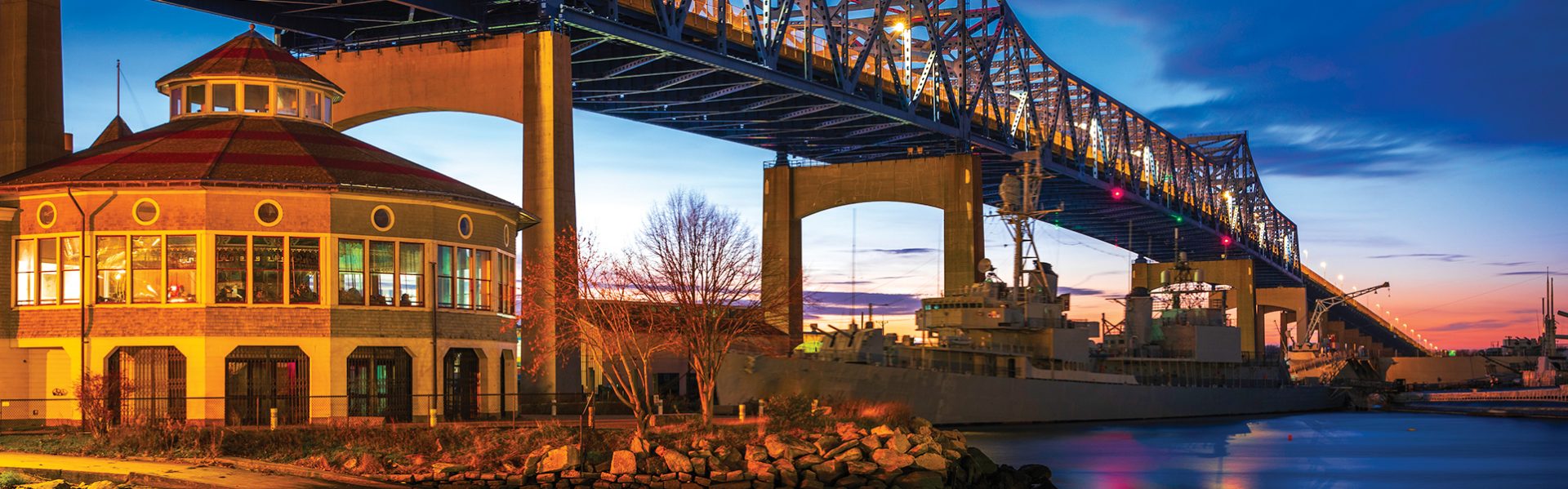 Dramatic twilight sky and reflections over the Fall River at Heritage State Park in Fall River, Massachusetts.